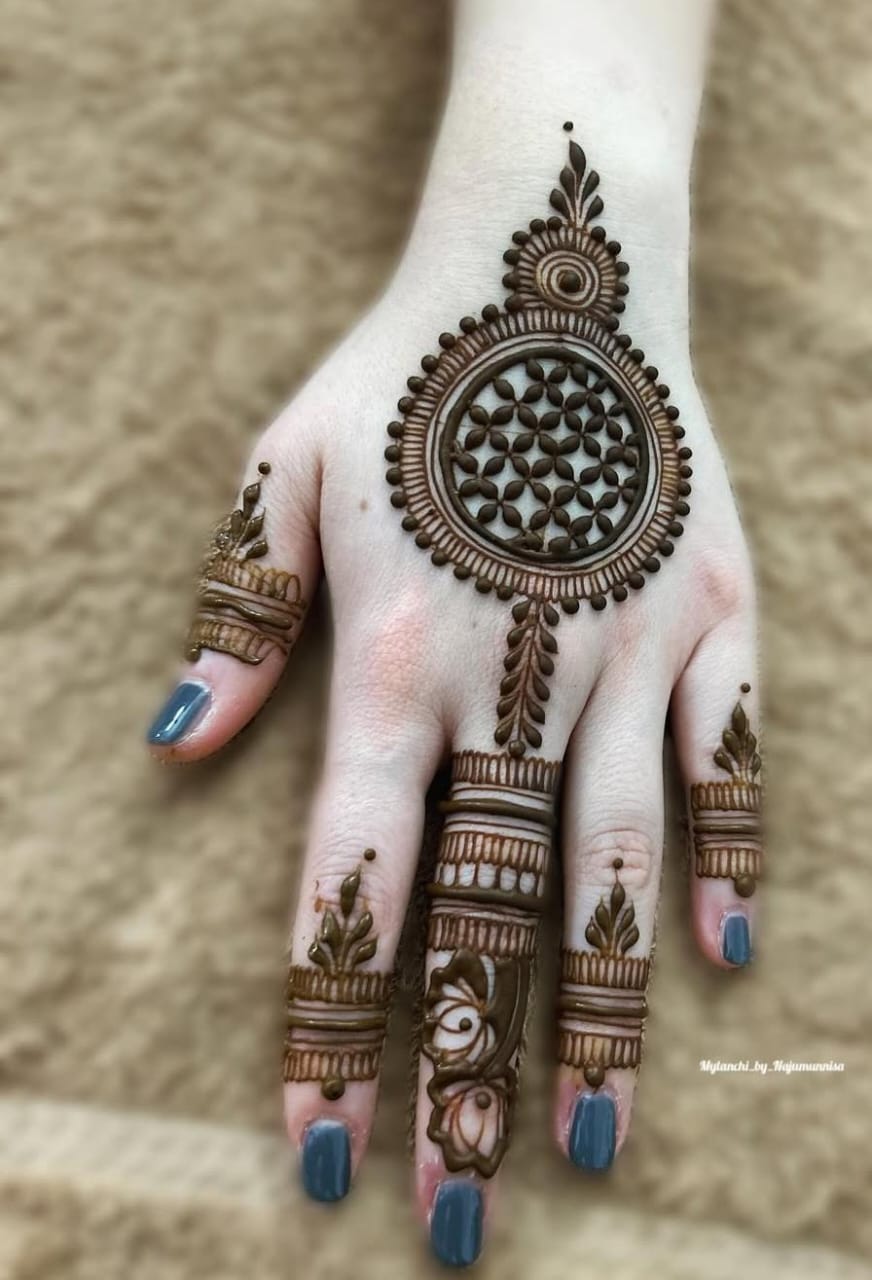 A person showing henna on their hands with a colorful background