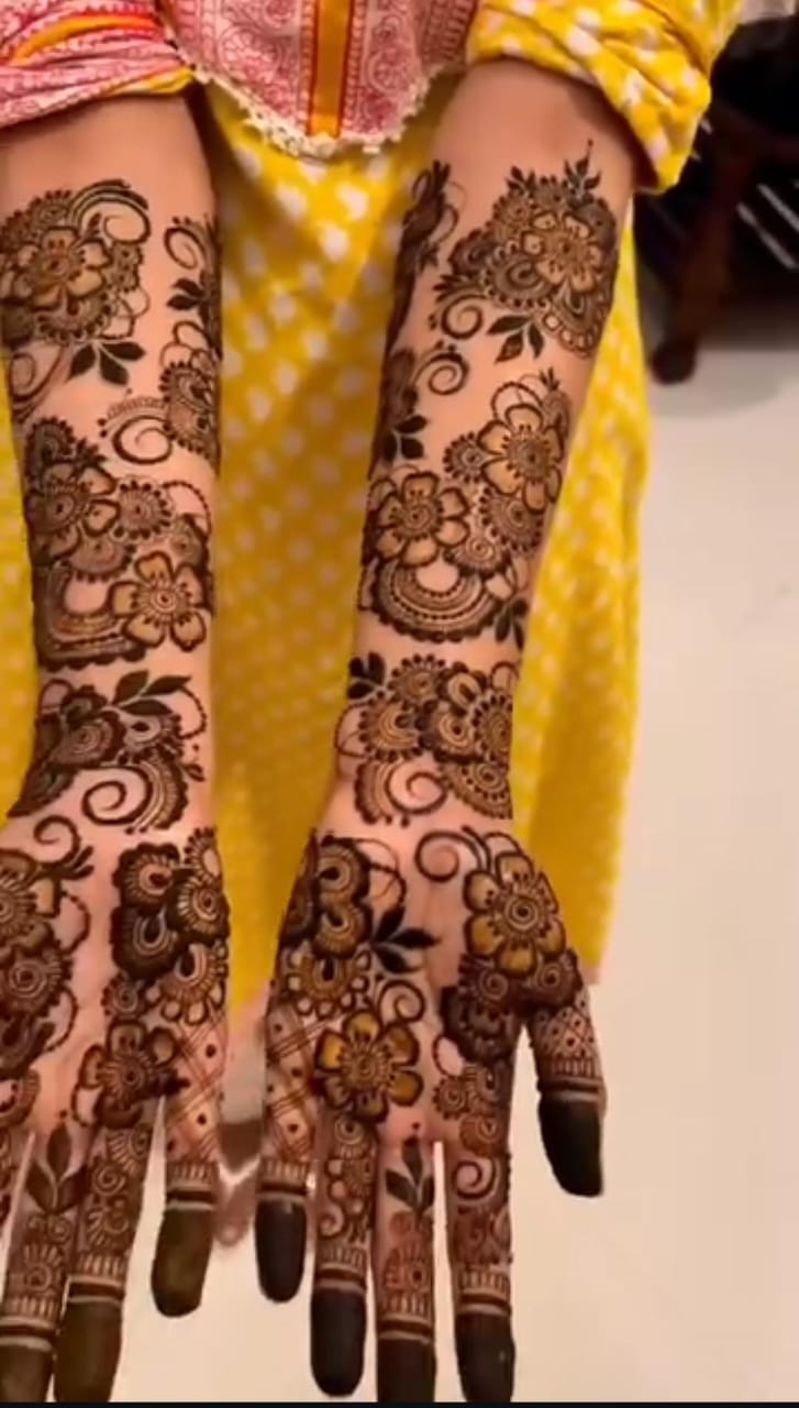 A detailed Bangle Style Mehndi design featuring intricate circular patterns around the wrist